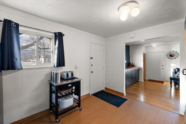 entrance foyer with hardwood / wood-style flooring and a textured ceiling