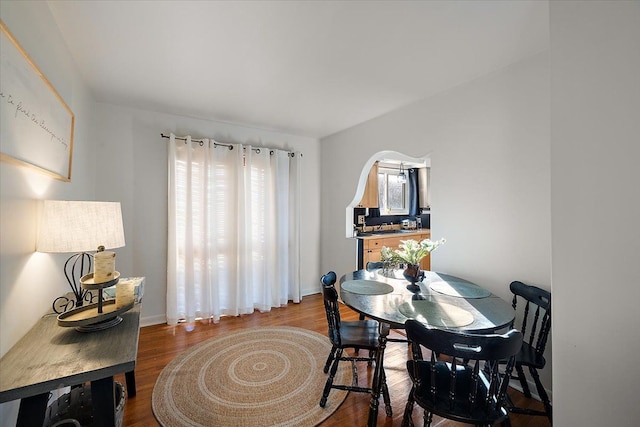 dining area featuring hardwood / wood-style floors and a healthy amount of sunlight