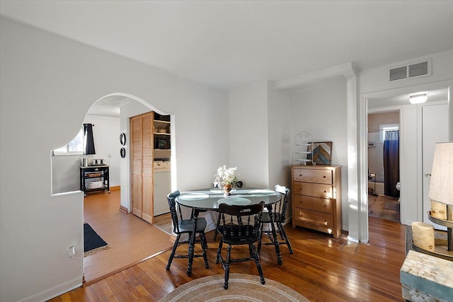 dining space featuring hardwood / wood-style floors