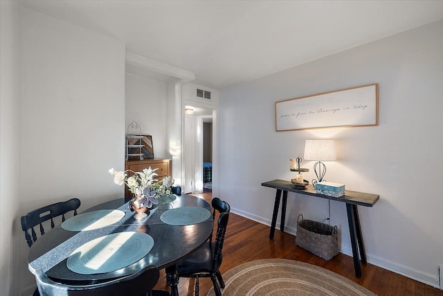 dining space featuring dark hardwood / wood-style floors