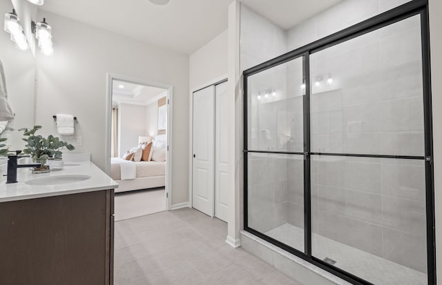 bathroom featuring an enclosed shower, vanity, and tile patterned floors