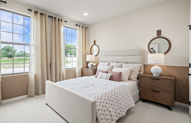 bedroom featuring light colored carpet