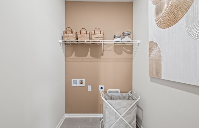 clothes washing area with electric dryer hookup, hookup for a washing machine, and tile patterned floors