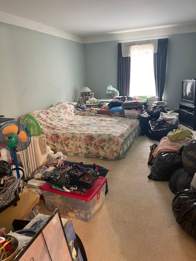 carpeted bedroom with ornamental molding