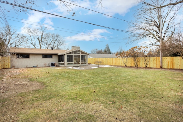 view of yard featuring a patio area and a sunroom