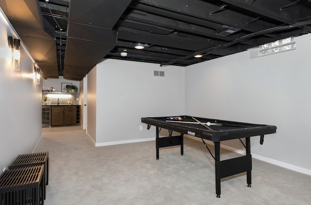 recreation room featuring light carpet