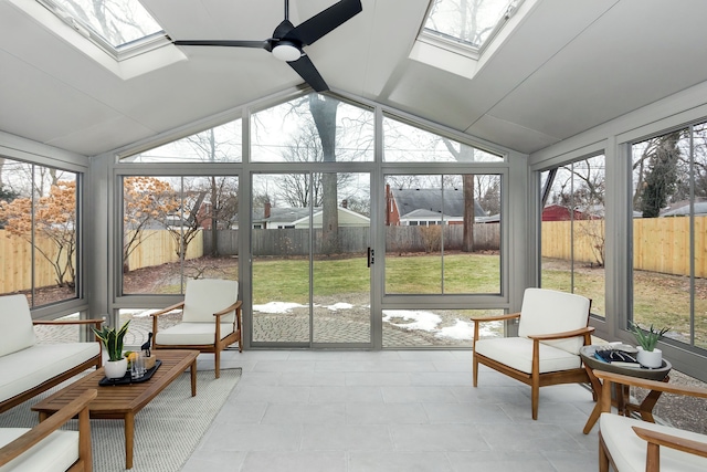 sunroom with vaulted ceiling with skylight and ceiling fan