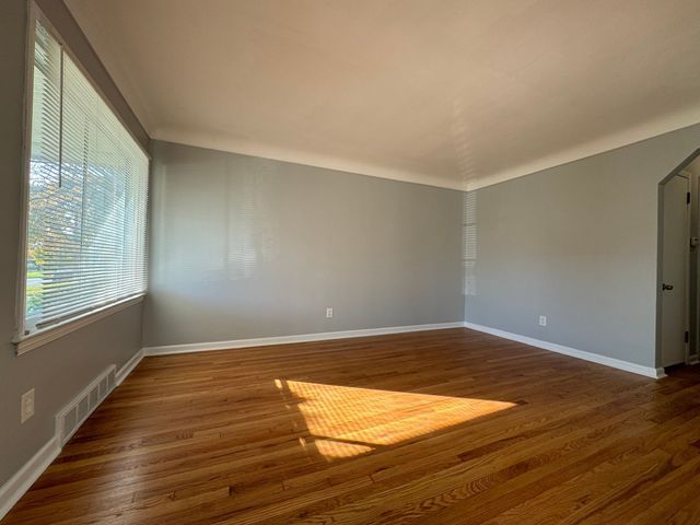 spare room featuring dark hardwood / wood-style floors