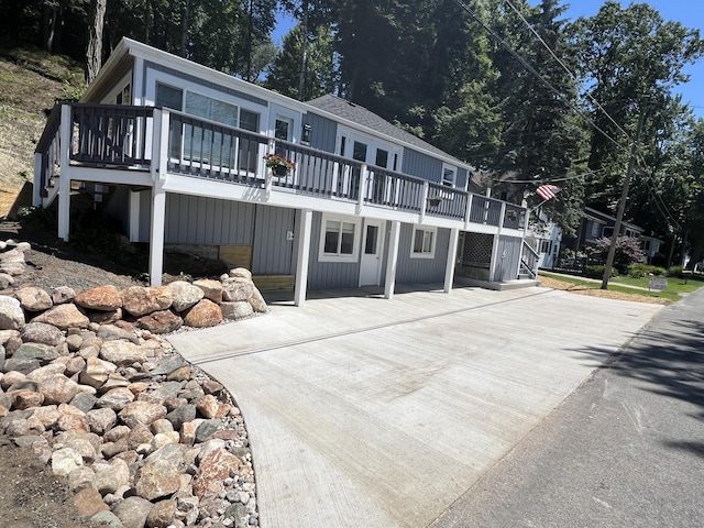 view of front facade with a wooden deck