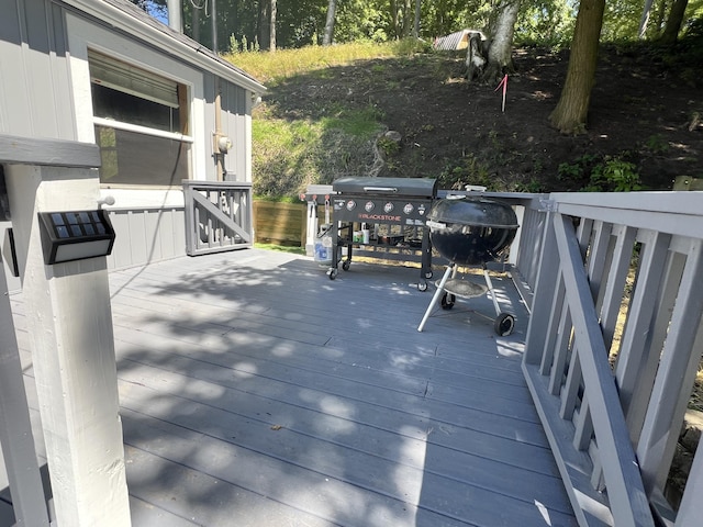 wooden deck with area for grilling