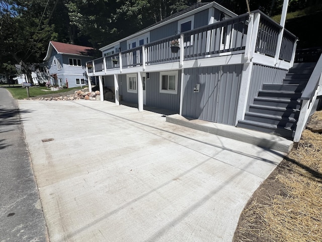 view of side of home featuring a deck