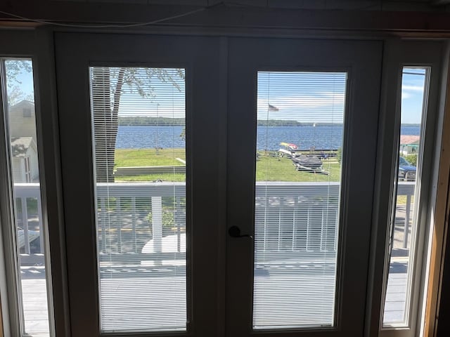 doorway to outside featuring french doors and a water view