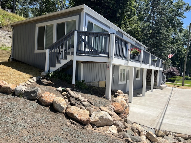 view of home's exterior with a wooden deck