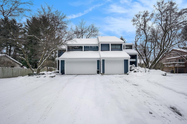 front of property with a garage