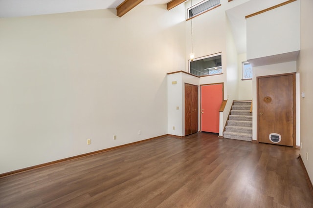 unfurnished living room featuring beamed ceiling, high vaulted ceiling, and dark hardwood / wood-style flooring