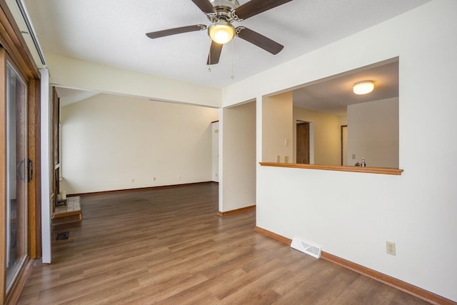 spare room featuring hardwood / wood-style flooring and ceiling fan