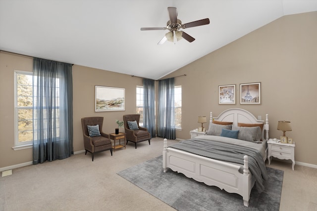 bedroom with vaulted ceiling, light colored carpet, and ceiling fan