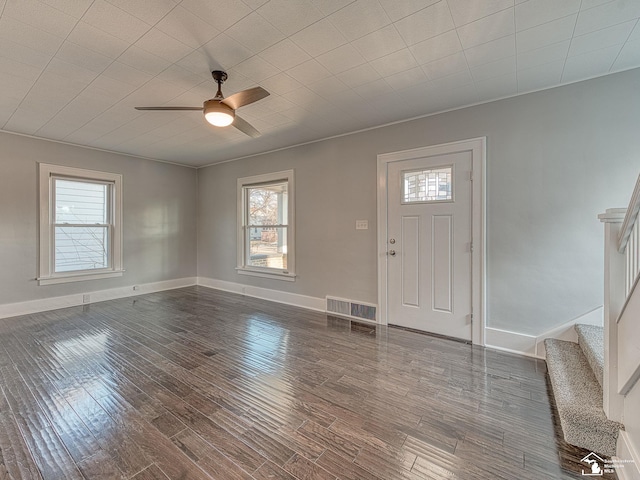 entryway with a wealth of natural light, dark hardwood / wood-style floors, and ceiling fan