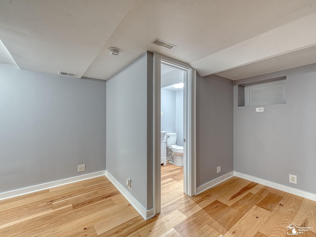 bonus room with lofted ceiling and light hardwood / wood-style floors