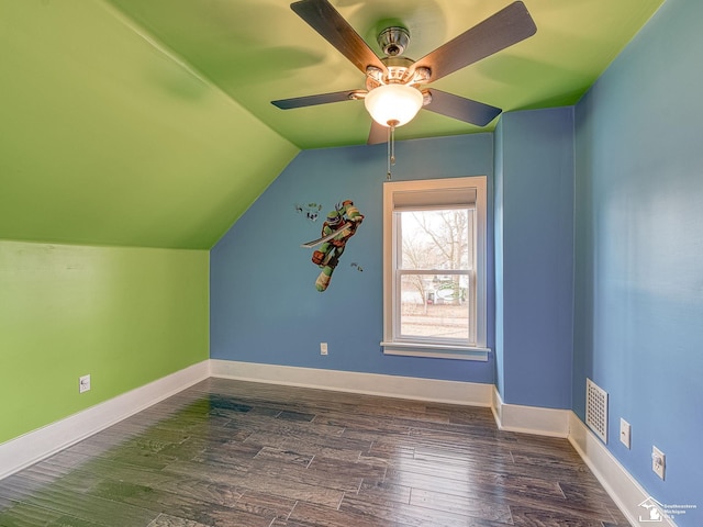 bonus room with ceiling fan, dark hardwood / wood-style flooring, and vaulted ceiling