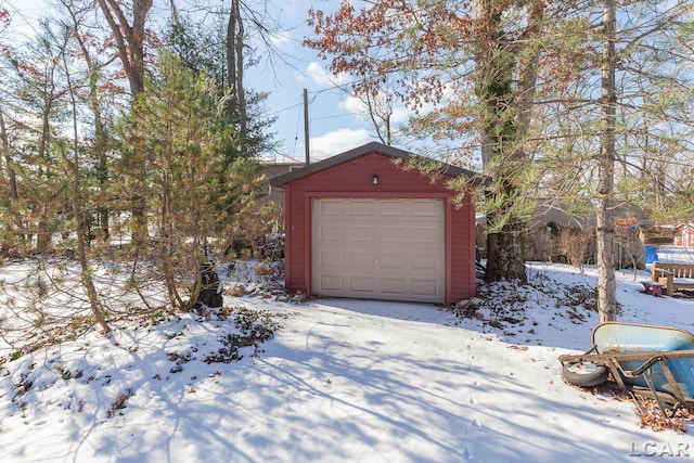 view of snow covered garage