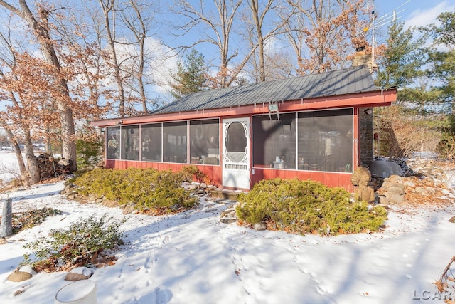 exterior space featuring a sunroom