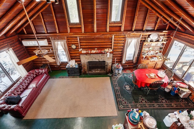 living room featuring beamed ceiling, a wall unit AC, wood ceiling, and high vaulted ceiling