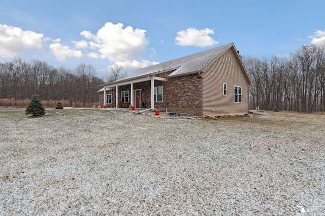 rear view of house with covered porch