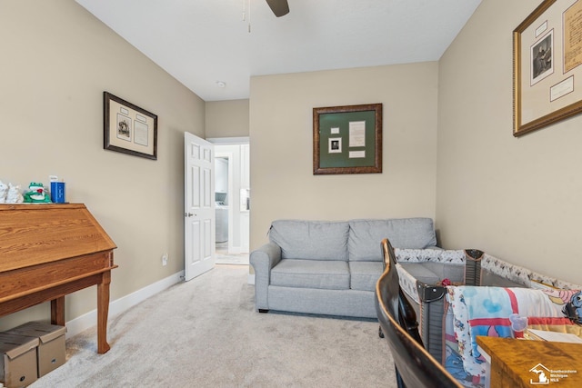 living room with light carpet and ceiling fan