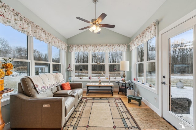 sunroom featuring ceiling fan and vaulted ceiling