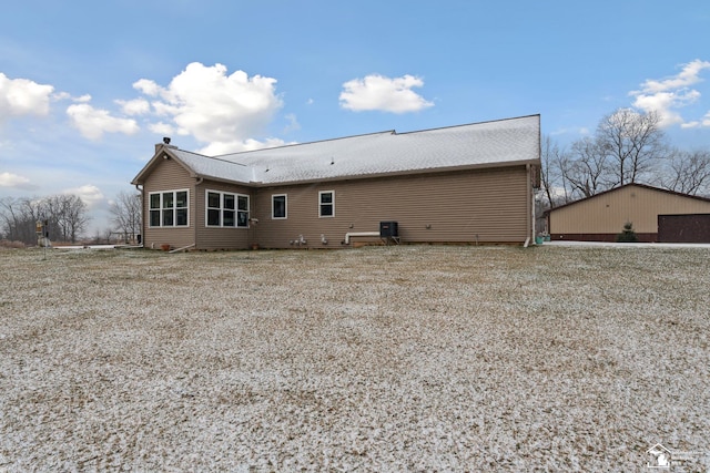 back of house with central AC