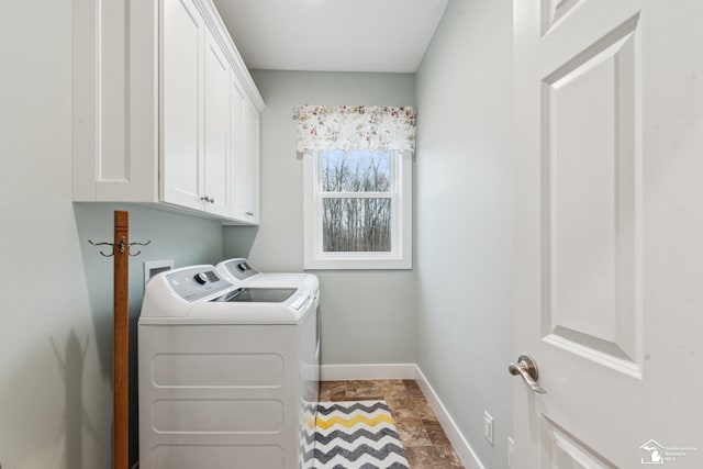 laundry room with cabinets and separate washer and dryer