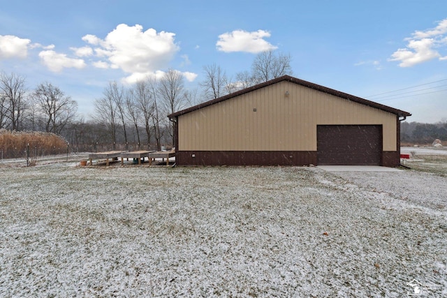 view of property exterior featuring a garage and an outdoor structure