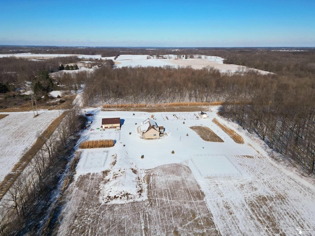 snowy aerial view featuring a rural view