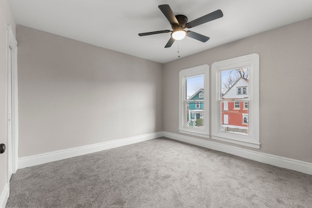 spare room with ceiling fan and carpet flooring