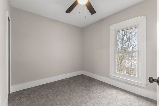 carpeted empty room with plenty of natural light and ceiling fan