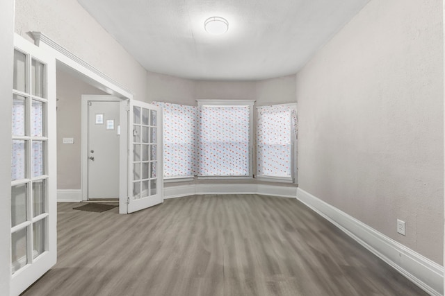 empty room with wood-type flooring