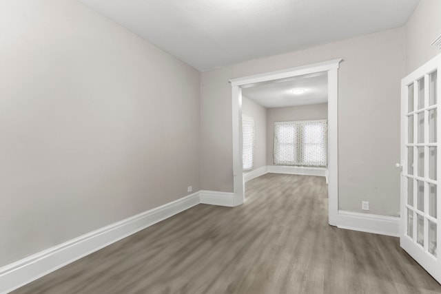 empty room with hardwood / wood-style floors