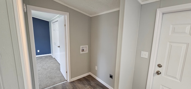 clothes washing area featuring hookup for a washing machine, ornamental molding, dark hardwood / wood-style flooring, and a textured ceiling