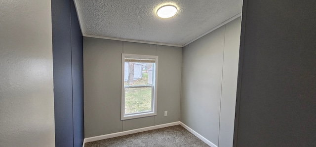 unfurnished room featuring carpet floors and a textured ceiling