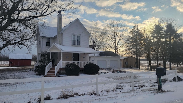 view of front of home featuring a garage and covered porch