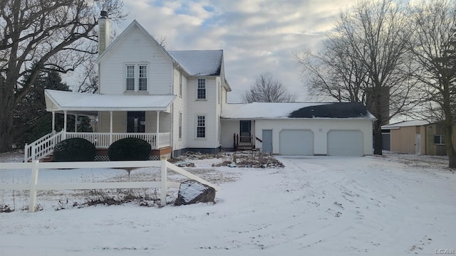 view of front of property with a porch and a garage