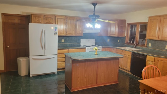 kitchen with sink, white appliances, dark tile patterned floors, tasteful backsplash, and a kitchen island