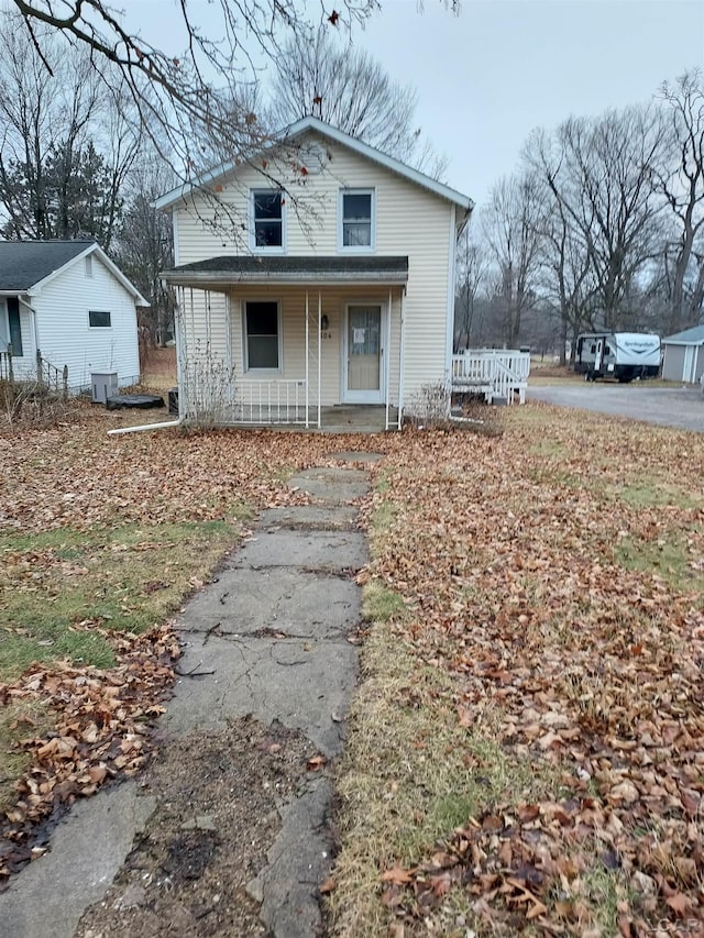 view of front of home featuring a porch and central AC unit