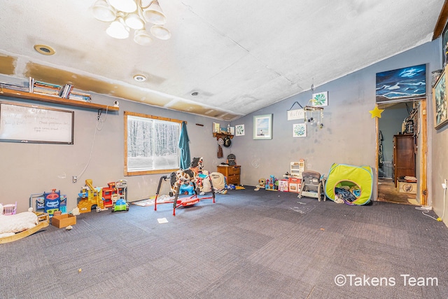 rec room with lofted ceiling and carpet