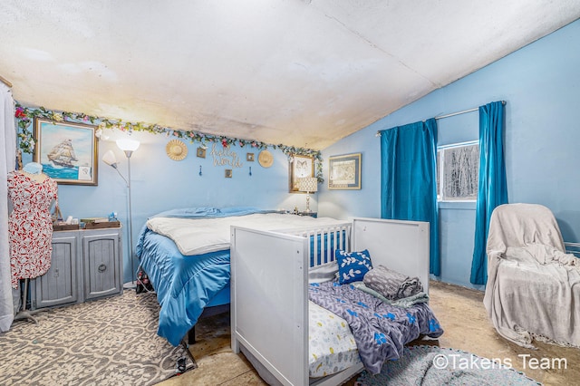 bedroom featuring lofted ceiling