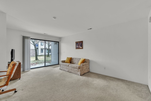 living area with light colored carpet