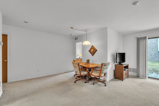 view of carpeted dining space