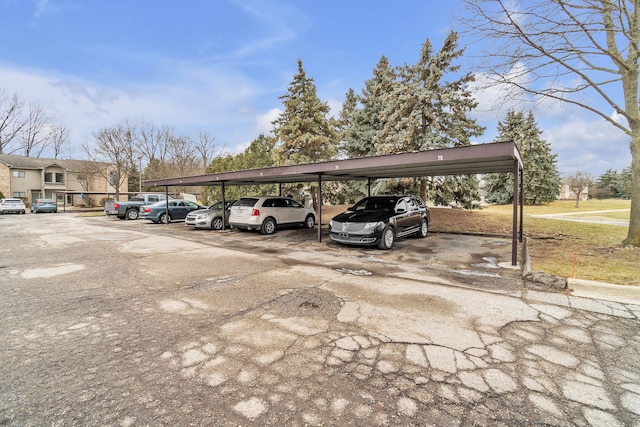 view of parking / parking lot featuring a carport