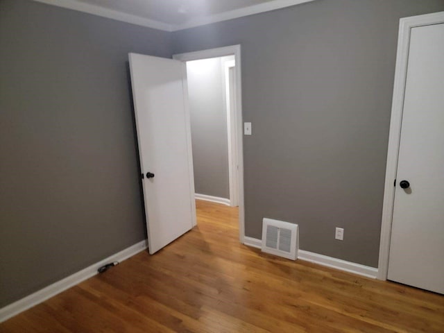 unfurnished room featuring light wood-type flooring